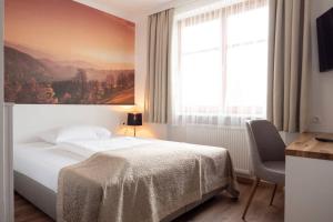 Rúm í herbergi á Gasthof Pack "Zur Lebing Au"