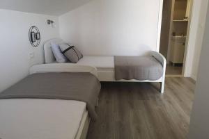 Postel nebo postele na pokoji v ubytování Apartman Mia