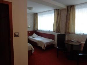 Postel nebo postele na pokoji v ubytování Mazowsze Medi Spa