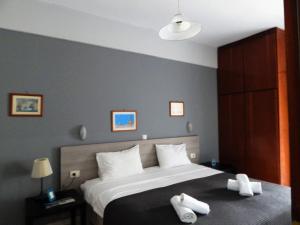 Postel nebo postele na pokoji v ubytování Posidonio Hotel