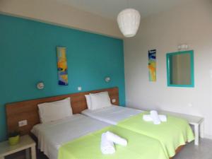 Postel nebo postele na pokoji v ubytování Posidonio Hotel