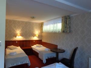 Postel nebo postele na pokoji v ubytování Mazowsze Medi Spa