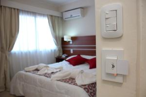 Ένα ή περισσότερα κρεβάτια σε δωμάτιο στο Hotel Identidad +27 φωτογραφίες