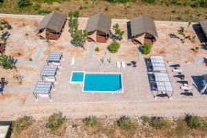 an overhead view of a patio with a swimming pool at Grande Glamping with Pool in Biograd na Moru