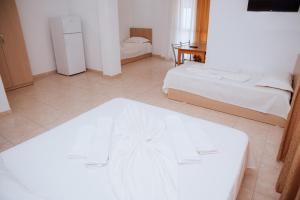 Ένα ή περισσότερα κρεβάτια σε δωμάτιο στο Hotel Perdja
