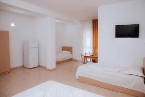 Ένα ή περισσότερα κρεβάτια σε δωμάτιο στο Hotel Perdja