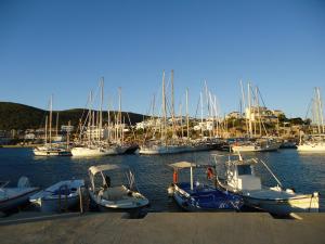 a group of boats docked in a harbor at Studio Mare in Megalochori