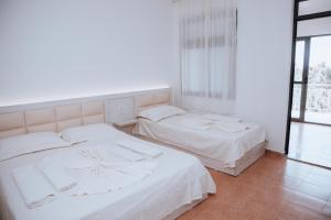 Ένα ή περισσότερα κρεβάτια σε δωμάτιο στο Hotel Perdja