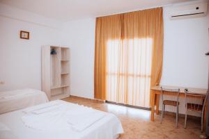 Ένα ή περισσότερα κρεβάτια σε δωμάτιο στο Hotel Perdja