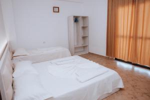 Ένα ή περισσότερα κρεβάτια σε δωμάτιο στο Hotel Perdja