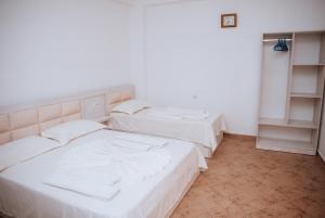 Ένα ή περισσότερα κρεβάτια σε δωμάτιο στο Hotel Perdja