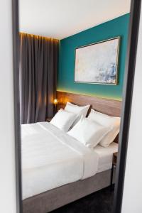 Postel nebo postele na pokoji v ubytování Boutique ROOMs 76