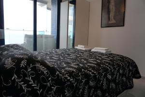 Posteľ alebo postele v izbe v ubytovaní SEA SENSES - Punta Prima - VISTA AL MAR