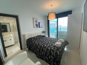 Posteľ alebo postele v izbe v ubytovaní SEA SENSES - Punta Prima - VISTA AL MAR