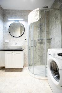 Koupelna v ubytování Resort Apartamenty Klifowa Rewal 59 + 13 fotografií