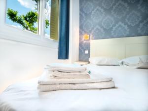 Letto o letti in una camera di Altera Roma Hôtel