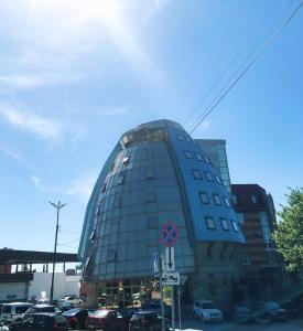 a round building with cars parked in a parking lot at Hotel Kremlevsky in Ryazan
