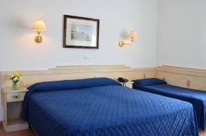 Letto o letti in una camera di Hotel I Due Gabbiani CITR 9006