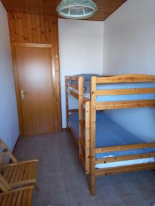 a room with two bunk beds and a door at B&B Isabella in Numana