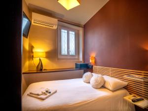 Letto o letti in una camera di Altera Roma Hôtel