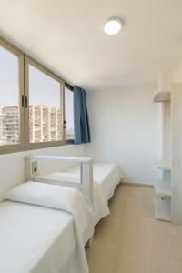 Postel nebo postele na pokoji v ubytování Aparthotel BCL Levante Lux + 33 fotografií