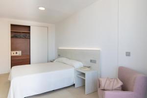 Postel nebo postele na pokoji v ubytování Aparthotel BCL Levante Lux