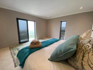 Ένα ή περισσότερα κρεβάτια σε δωμάτιο στο Ocean pearl seafront villa