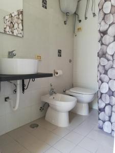 a bathroom with a toilet and a sink at Casa vacanze Ombretta in Ponza