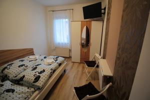 Postel nebo postele na pokoji v ubytování Gasthaus Blunzenwirt