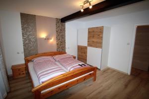 Postel nebo postele na pokoji v ubytování Gasthaus Blunzenwirt