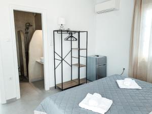 Cama ou camas em um quarto em Fabrica Sunset Apartments