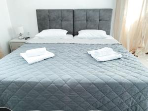 Cama ou camas em um quarto em Fabrica Sunset Apartments