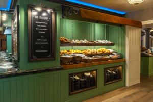a display case in a bakery with different types of bread at Europa Hotel Kühlungsborn in Kühlungsborn