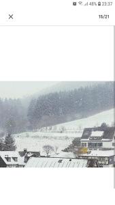 a view of a snow covered field with a house at 4 Erw. 1 Ki. Ski Entspannung Terasse Ausblick in Schmallenberg