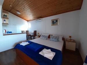 Posteľ alebo postele v izbe v ubytovaní Apartmani Tomić