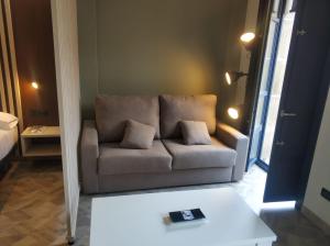 Łóżko lub łóżka w pokoju w obiekcie Apartamentos Turísticos y Habitaciones Cidade Vella by Bossh! Hotels