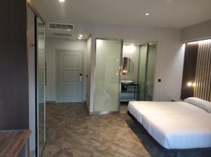 Łóżko lub łóżka w pokoju w obiekcie Apartamentos Turísticos y Habitaciones Cidade Vella by Bossh! Hotels
