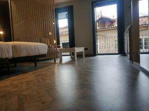 Łóżko lub łóżka w pokoju w obiekcie Apartamentos Turísticos y Habitaciones Cidade Vella by Bossh! Hotels