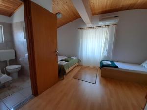 Posteľ alebo postele v izbe v ubytovaní Apartmani Tomić
