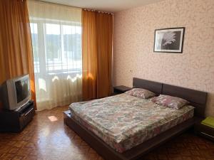 Cama o camas de una habitación en Apartments on Otradnaya 79