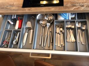 a drawer full of utensils in a cabinet at BUDE'55 Loft 14 in Winterberg