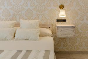 Postel nebo postele na pokoji v ubytování Hostal Peñiscola