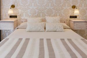 Postel nebo postele na pokoji v ubytování Hostal Peñiscola