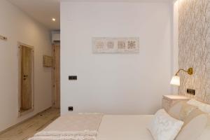 Postel nebo postele na pokoji v ubytování Hostal Peñiscola