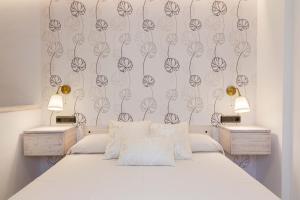 Postel nebo postele na pokoji v ubytování Hostal Peñiscola