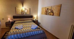 A bed or beds in a room at VILLA MARIANNA CON PISCINA PRIVATA ampi spazi esterni e WIFI FREE