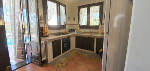 A kitchen or kitchenette at VILLA MARIANNA CON PISCINA PRIVATA ampi spazi esterni e WIFI FREE