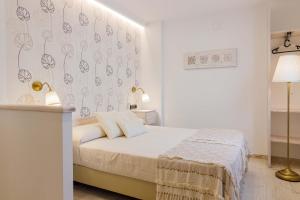 Postel nebo postele na pokoji v ubytování Hostal Peñiscola