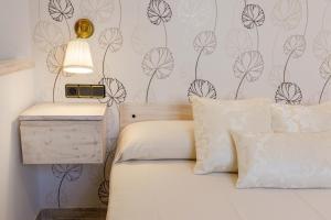 Postel nebo postele na pokoji v ubytování Hostal Peñiscola