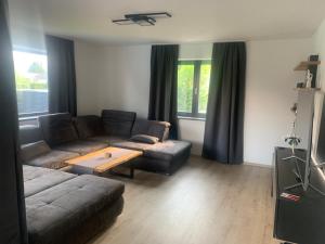 a living room with a couch and a table at SD-Apartment in Spielberg